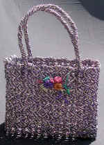 woman woven handbag by art export bali indonesia