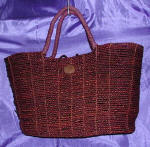 woman woven handbag by art export bali indonesia