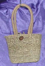 woman woven handbag by art export bali indonesia