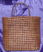 woman woven handbag by art export bali indonesia