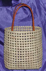 woman woven handbag by art export bali indonesia